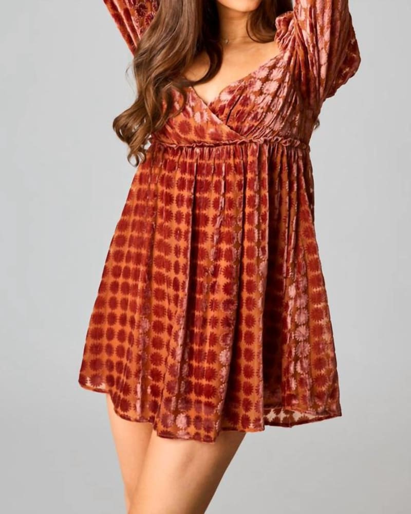 Front of a model wearing a size Large Fallon Babydoll Mini Dress In Butternut in Butternut by BUDDYLOVE. | dia_product_style_image_id:353751